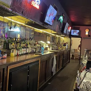 a bar with several televisions