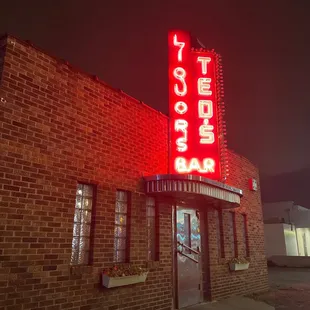 the neon sign for the restaurant