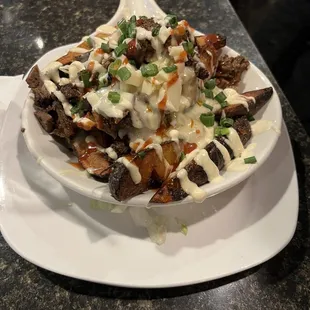 a plate of fries with sauce