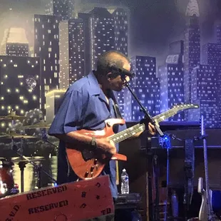 a man playing a guitar