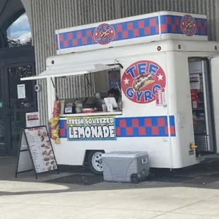 a food truck parked outside of a building