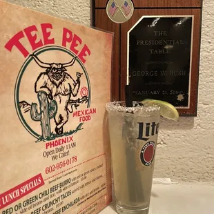 Menu, margaritas and plaque depicting where George Bush sat