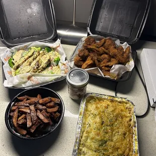 Chicken over rice, macaroni and cheese, wings and fries