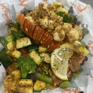 Veggie Ricebowl topped with a sauté Lobsters Bite