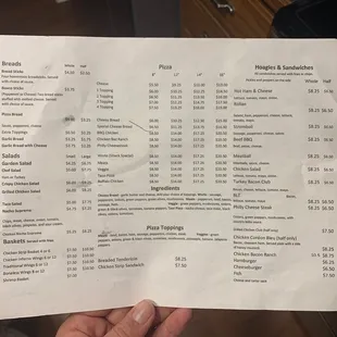 a person holding a menu