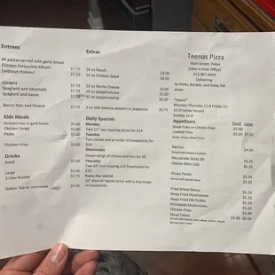 a person holding a menu