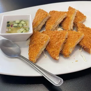 - [ ] Thai toast   Marinated ground chicken, cilantro, onion, garlic deep fried with egg served in a cucumber sauce