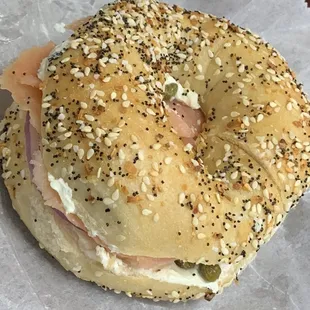 a bagel with ham and cheese