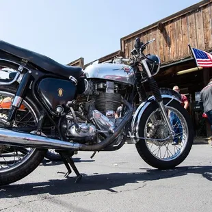 a motorcycle parked in front of a restaurant