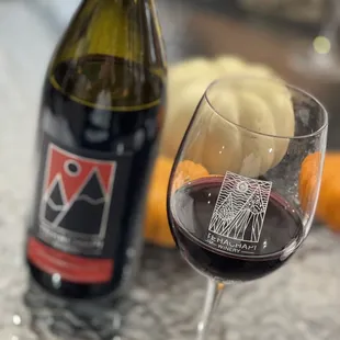 a glass of wine and a bottle of wine