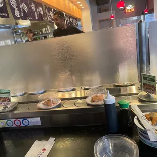 a counter with plates of food on it