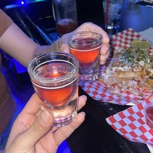 two people toasting glasses of wine