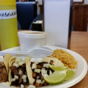 a plate of tacos and rice