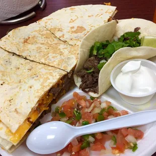 Steak quesadilla with a barbacoa taco.
