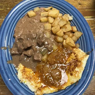 Huecos Rancheros topped with Carne Guisada