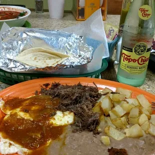 Huevos rancheros, with beans, potatoes and barbacoa