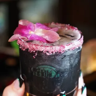 a person holding a drink