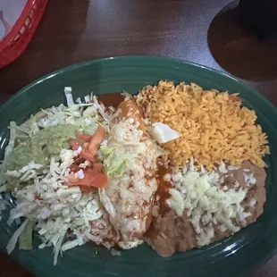 Grilled chicken enchilada, tostadas with rice and beans.