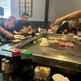 a group of people preparing food