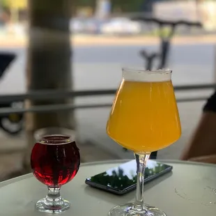 two glasses of beer on a table