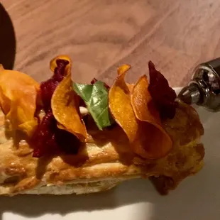 Prime Wellington being injected with sauce