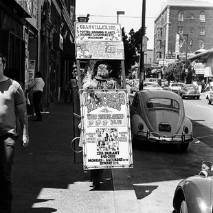 Sandwich board on Telegraph Ave., advertising new Rolling Stones album available at LEOPOLD'S. - - -Tom Brody