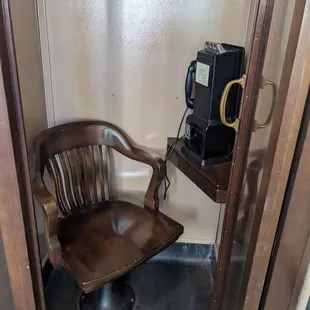 Old little phone booth at front