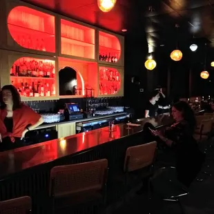 people sitting at a bar