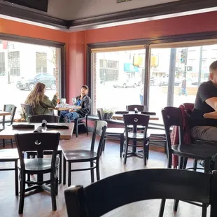 people sitting at tables in a restaurant