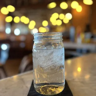 a jar of water on a table