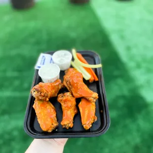 a tray of chicken wings