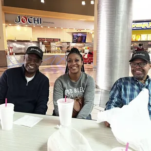 Happy faces in the foodcourt setting.
