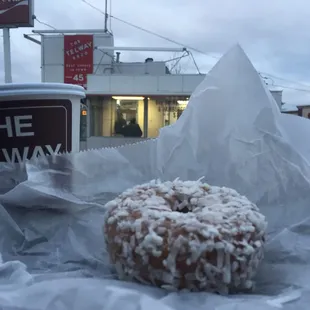 The coffee and a coconut donut - breakfast of champions.