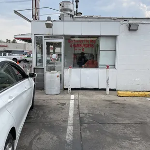 a car parked in front of a restaurant