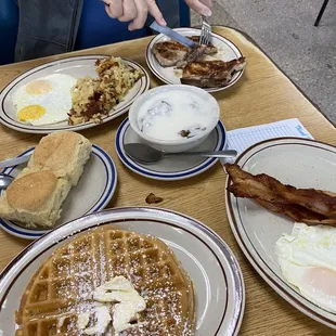 Belgian waffle eggs, bacon, sausage gravy, pork chops, hash browns and giant biscuits.