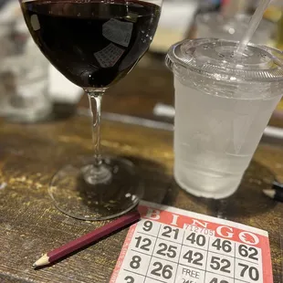 a glass of wine and a bingo card