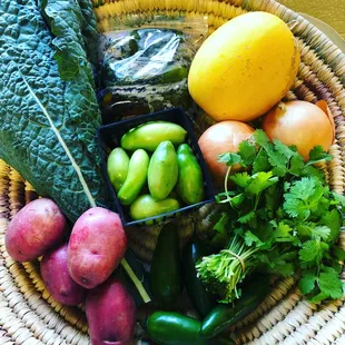 A November 2018 Classic Share: jalapeños, red potatoes, spaghetti squash, gold onions, roasted bell peppers, cilantro, green tomatoes, kale