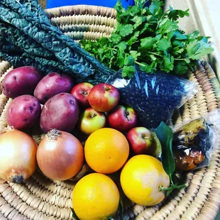 A November 2018 classic share: oranges, cilantro, lacinato kale, black beans, Jonathan apples, red potatoes, gold onions, roasted chilies