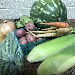 A July 2018 Classic Share: Corn, Carrots, Red Creamer Potatoes, Watermelon, Glendale Gold Sweet Onions, Green Beans, Tomatillos