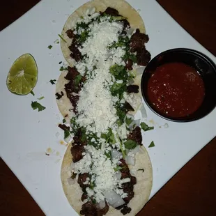 Carne asada tacos with cojita cheese