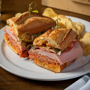 a sandwich and chips on a plate