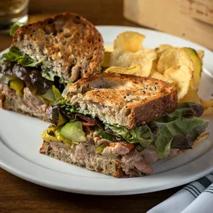 a sandwich and chips on a plate