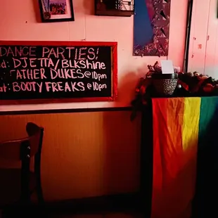 a rainbow flag hanging on the wall