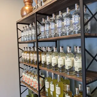 a shelf full of liquor bottles