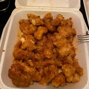 a chicken dish in a styrofoam container