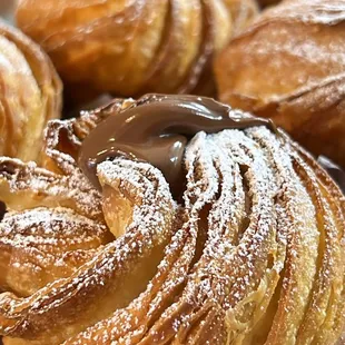 CROISSANT IN A MUFFIN SHAPE?

It is a big YES, We fill these Cruffins with Custard cream, Nutella and  churro that you will love