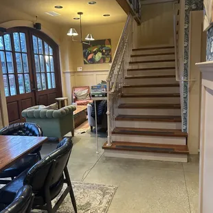 a dining room and stairs