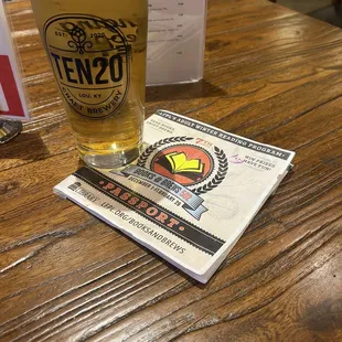 a pint of beer and a menu