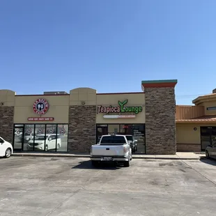 In a strip of shops by the dome like building