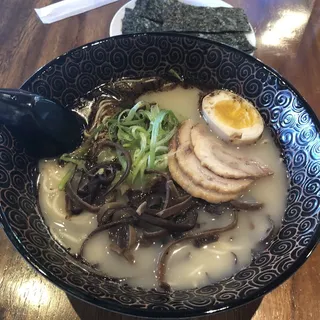 Add roasted black garlic oil